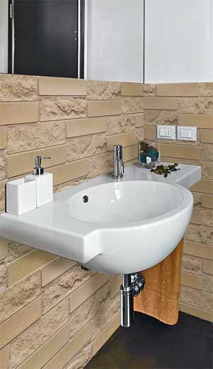 Industrial Concrete Wall Panelling Shown in Bathroom Around Sink and Mirror
